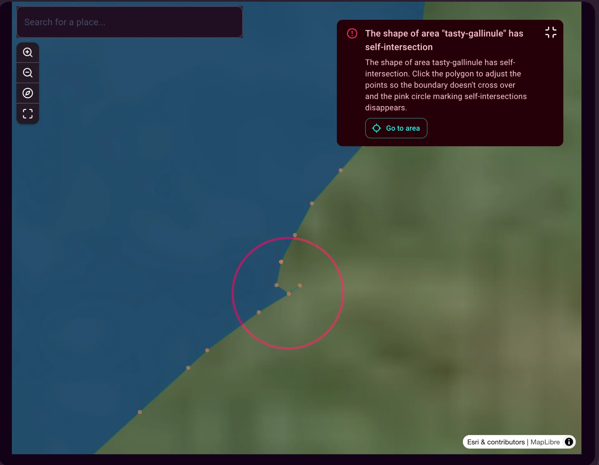 Zoomed to a single vertex of a farm polygon. The pink circle marks where the polygon boundary crosses itself; clicking the vertex resolves the error.